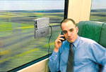 Isun charging a cell phone on a train